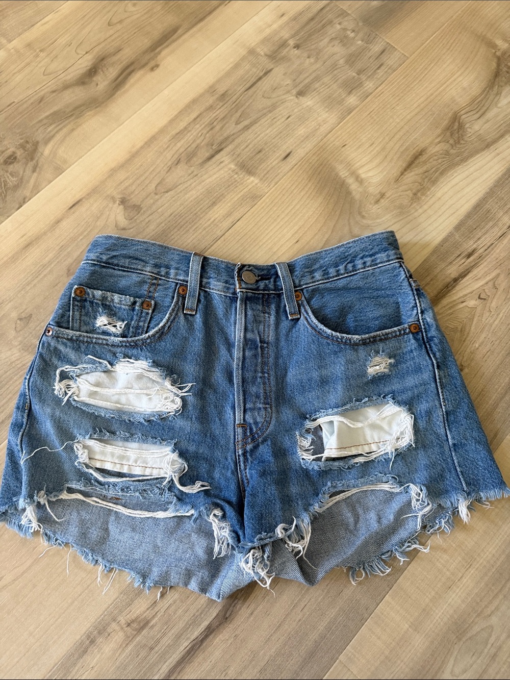 size 26W high waisted Levi 501 jean shorts w rips